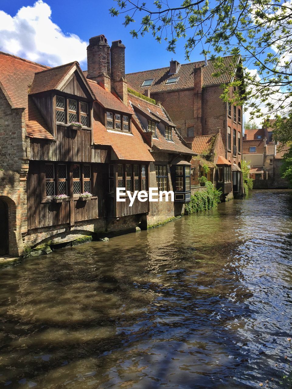 VIEW OF BUILT STRUCTURE WITH BUILDINGS IN FOREGROUND