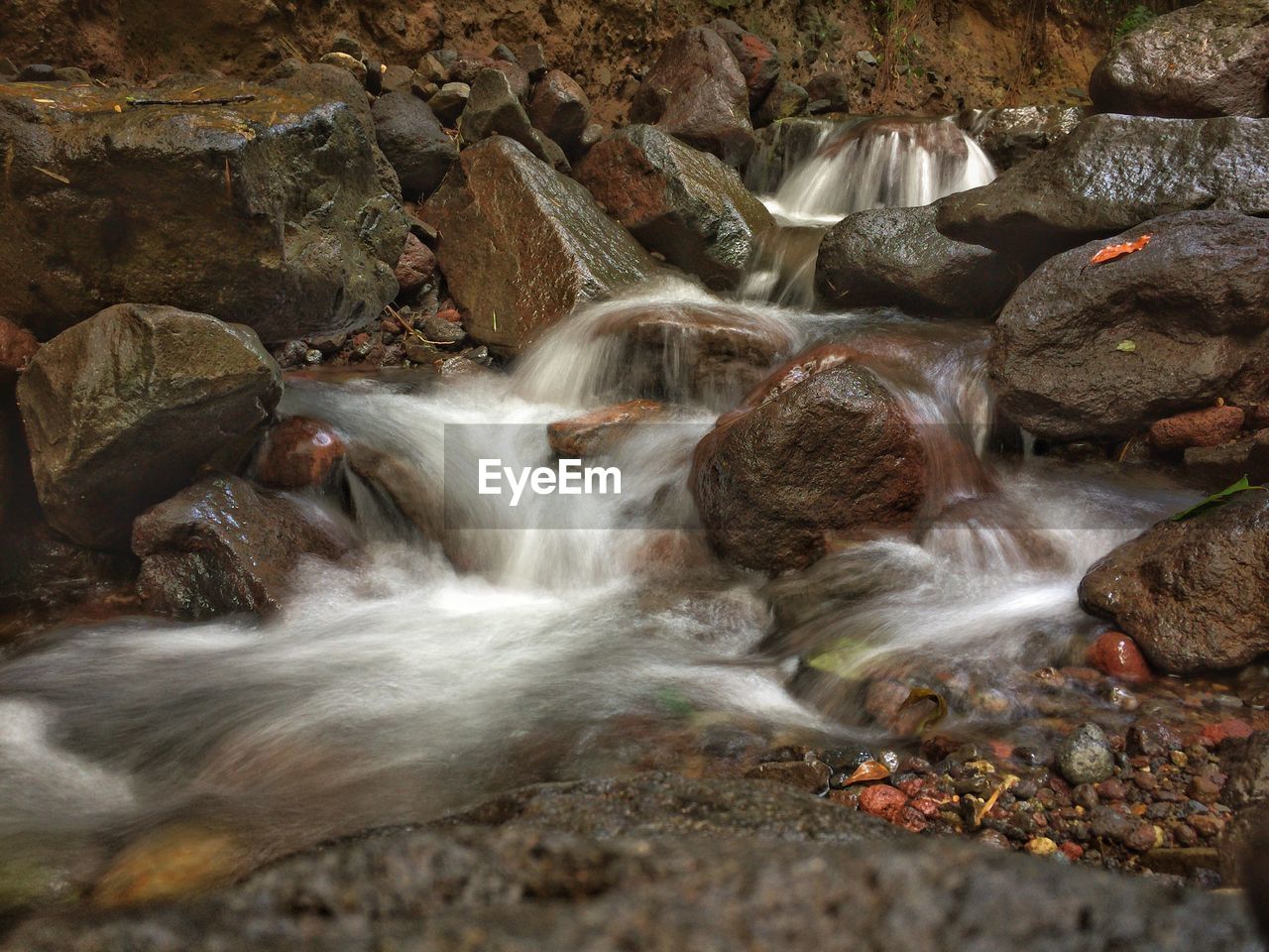 Close-up of stream along rocks