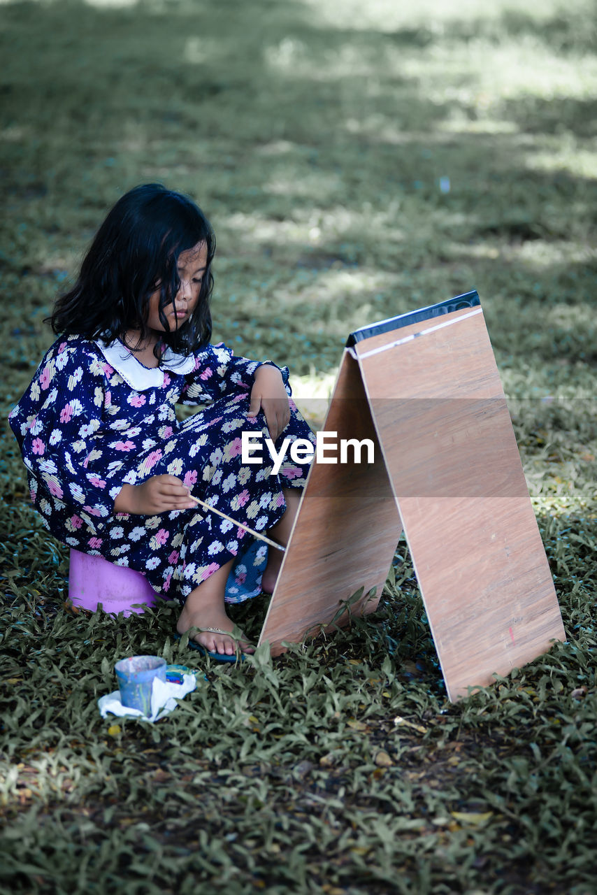 Young woman reading book