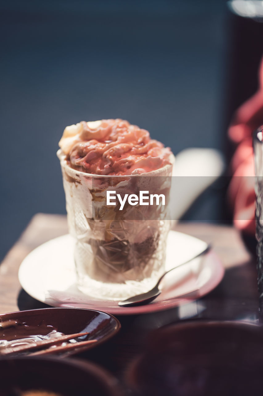 Close-up of ice cream in glass on table