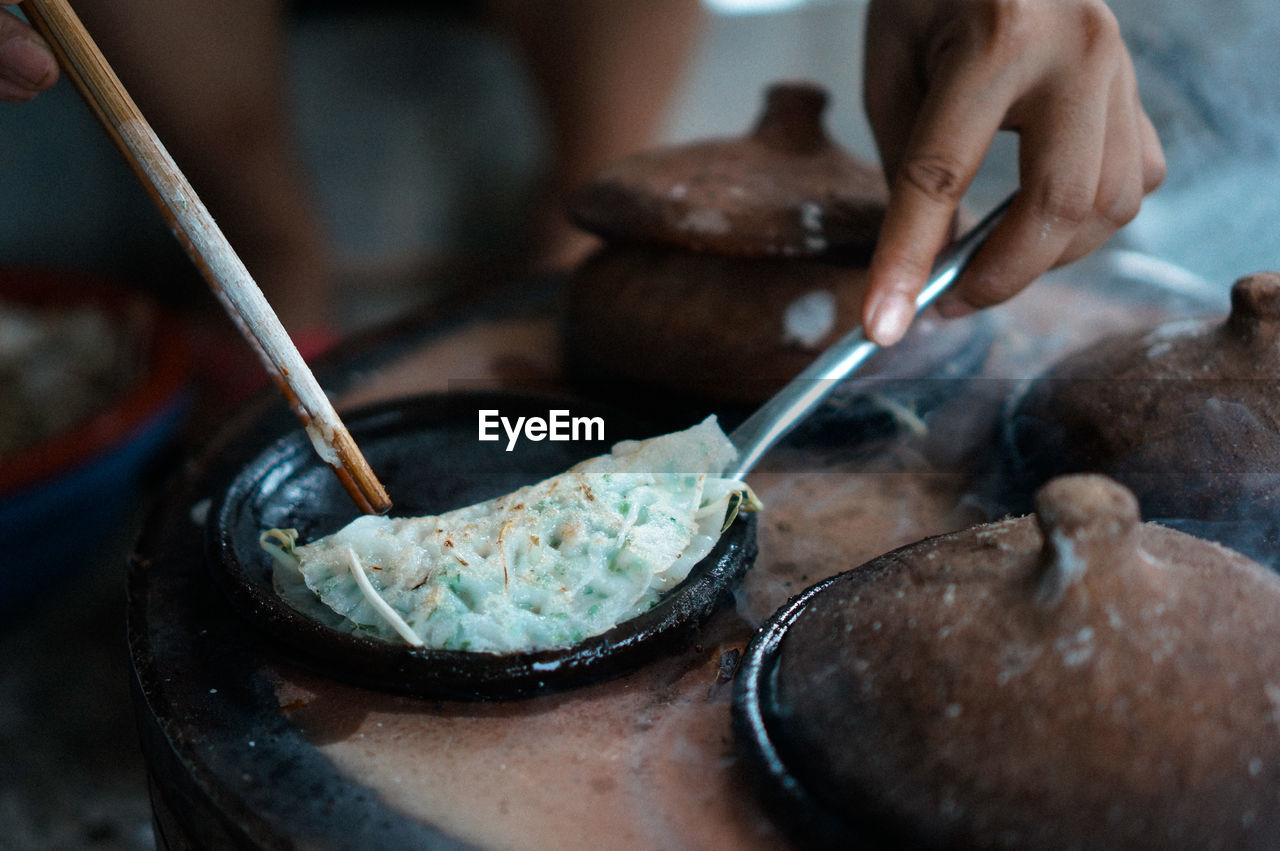 Close-up of person preparing food