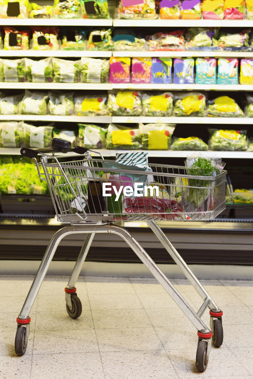 Groceries in shopping cart at supermarket