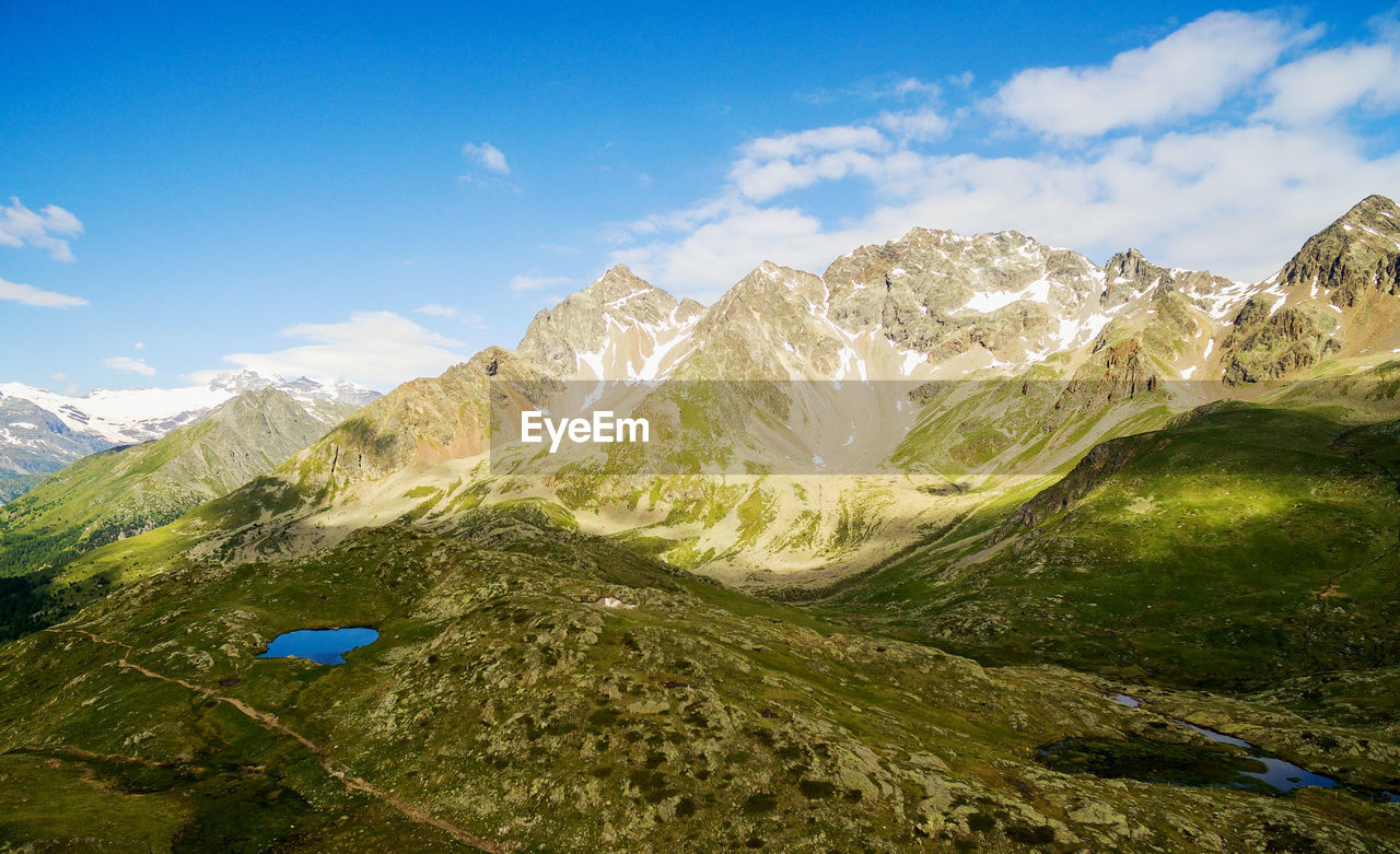 SCENIC VIEW OF VOLCANIC MOUNTAIN AGAINST SKY