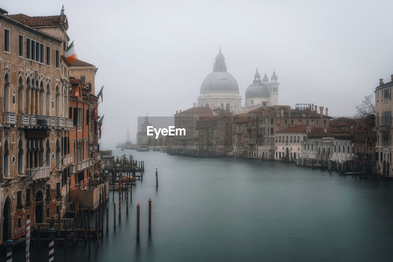 Buildings along canal in city