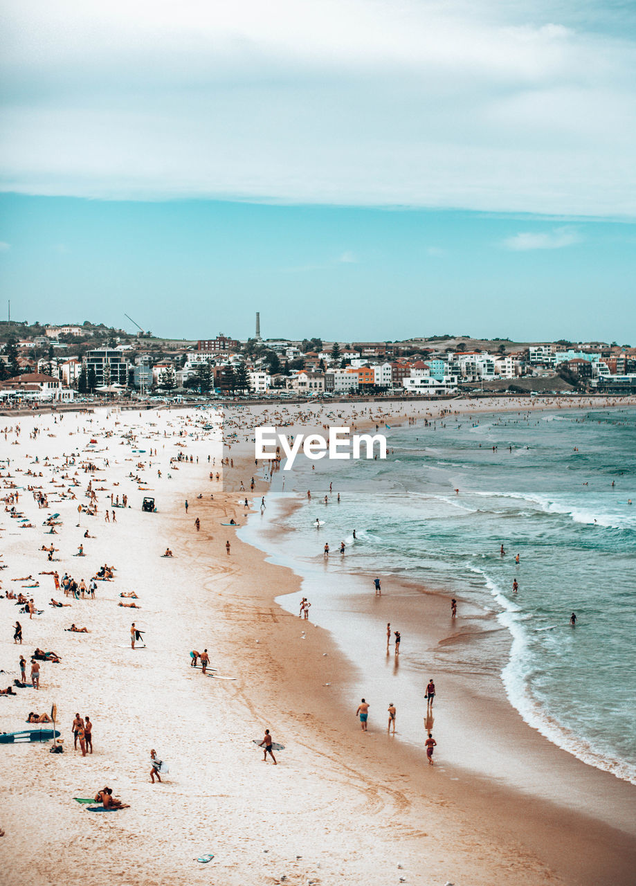 HIGH ANGLE VIEW OF PEOPLE AT BEACH