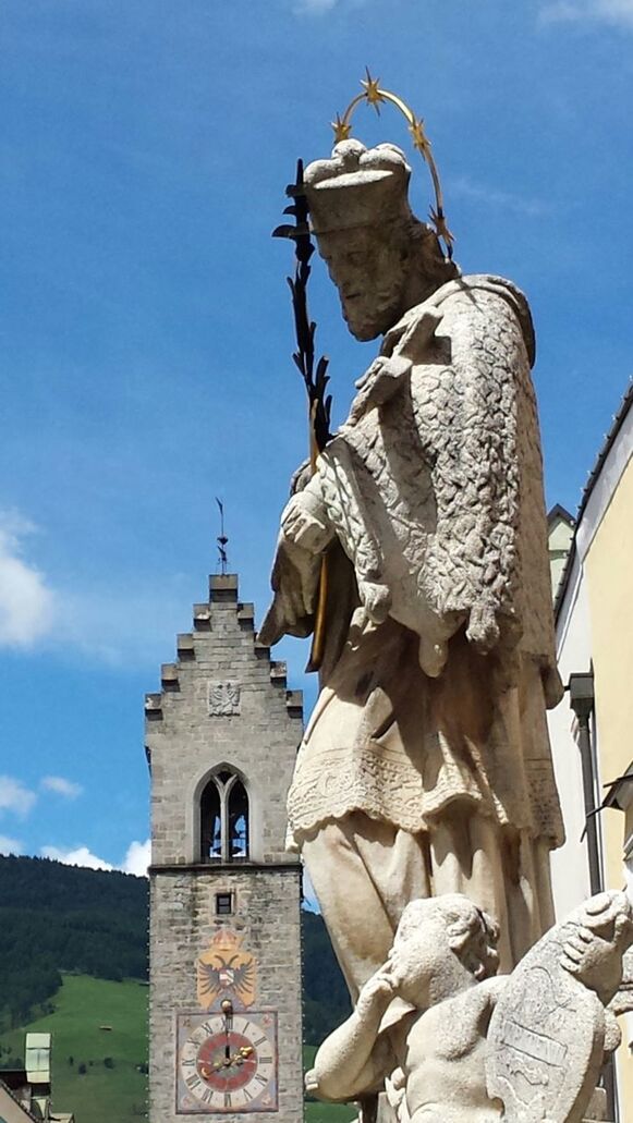 Low angle view of statue against blue sky