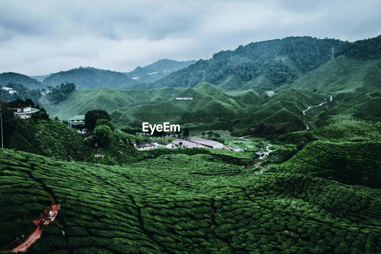 SCENIC VIEW OF MOUNTAINS AGAINST SKY DURING SUNNY DAY