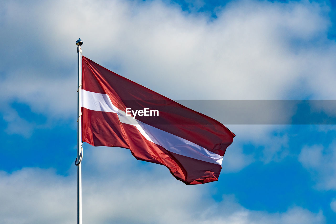 Low angle view of flag against sky