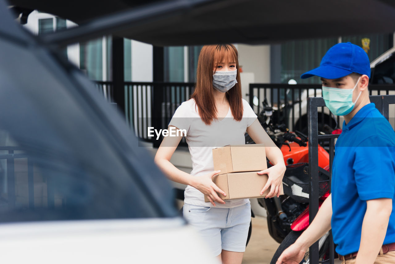 Woman standing in car