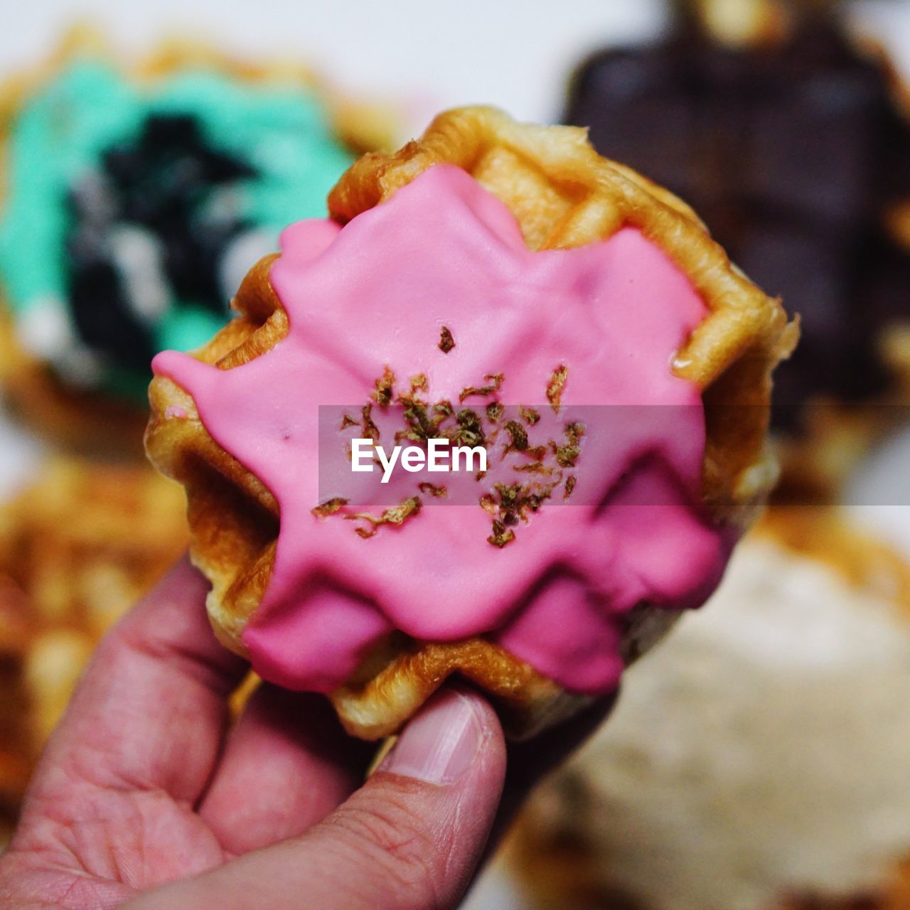 Cropped image of person holding dessert