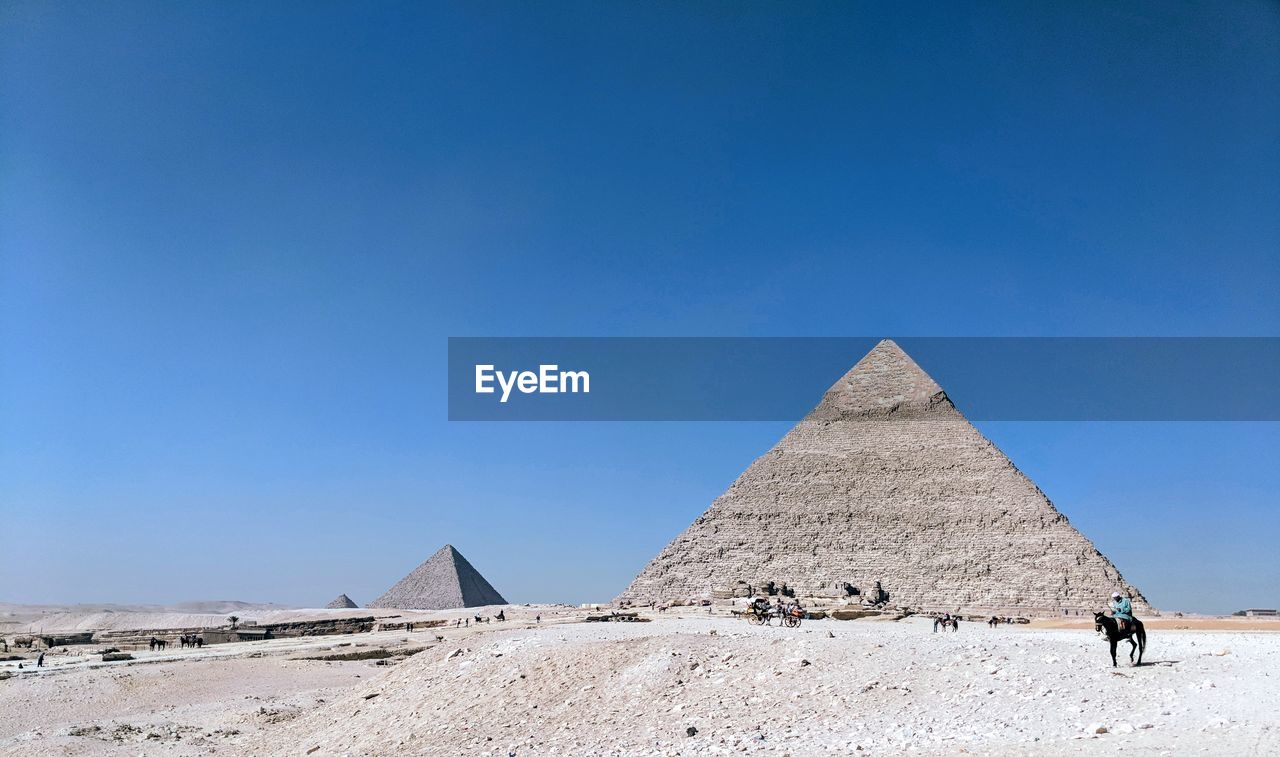 Pyramid against clear blue sky 