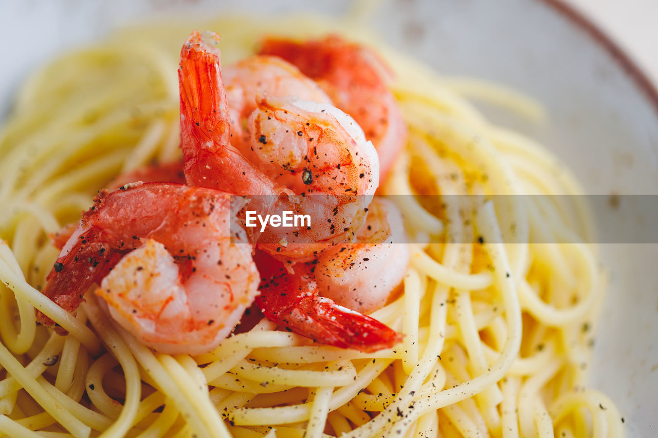 CLOSE-UP OF PASTA SERVED IN PLATE WITH SAUCE