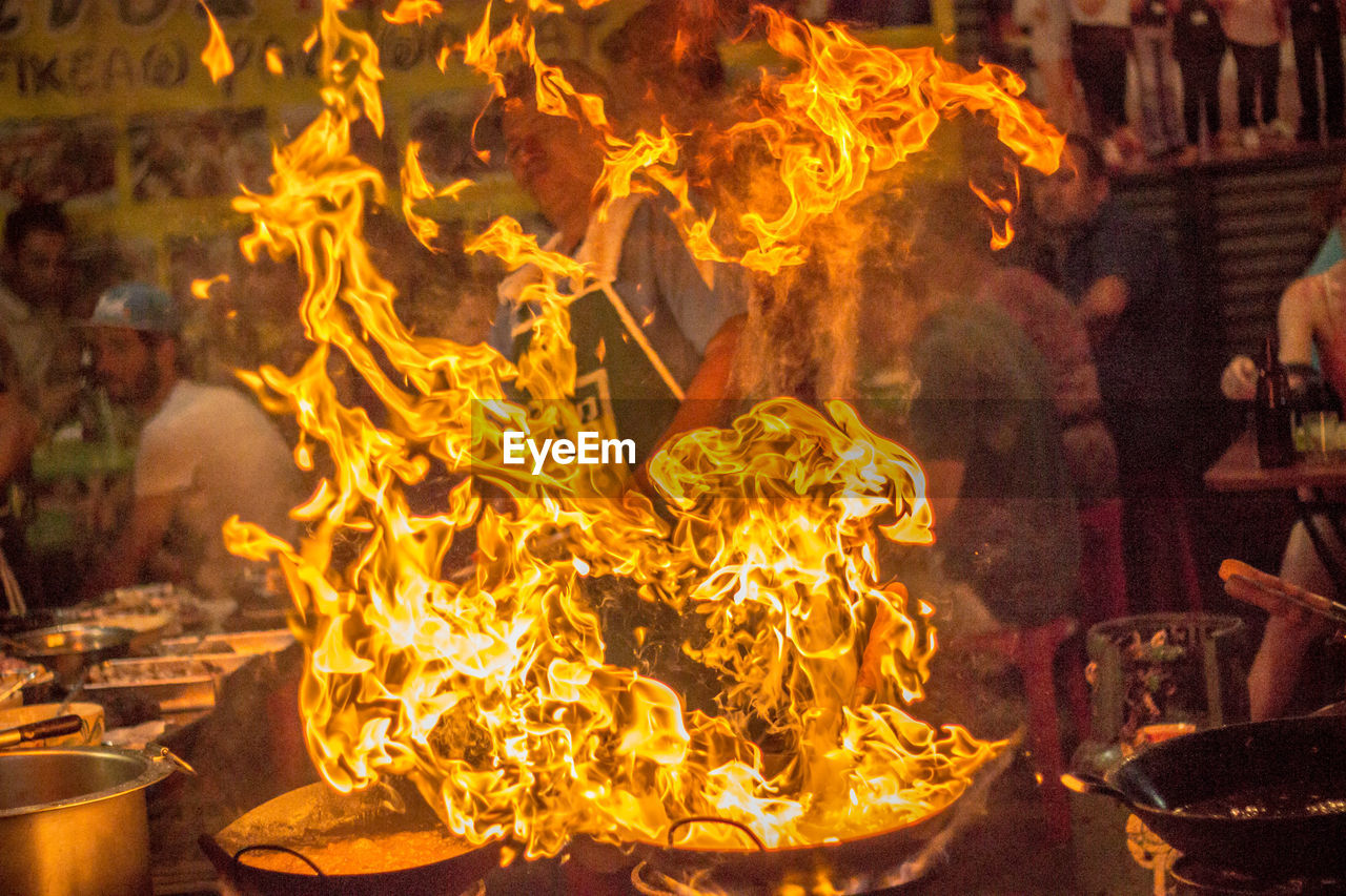 CLOSE-UP OF FIRE BURNING IN THE DARK