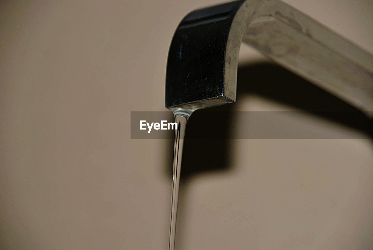 High angle view of metallic object over water against white background