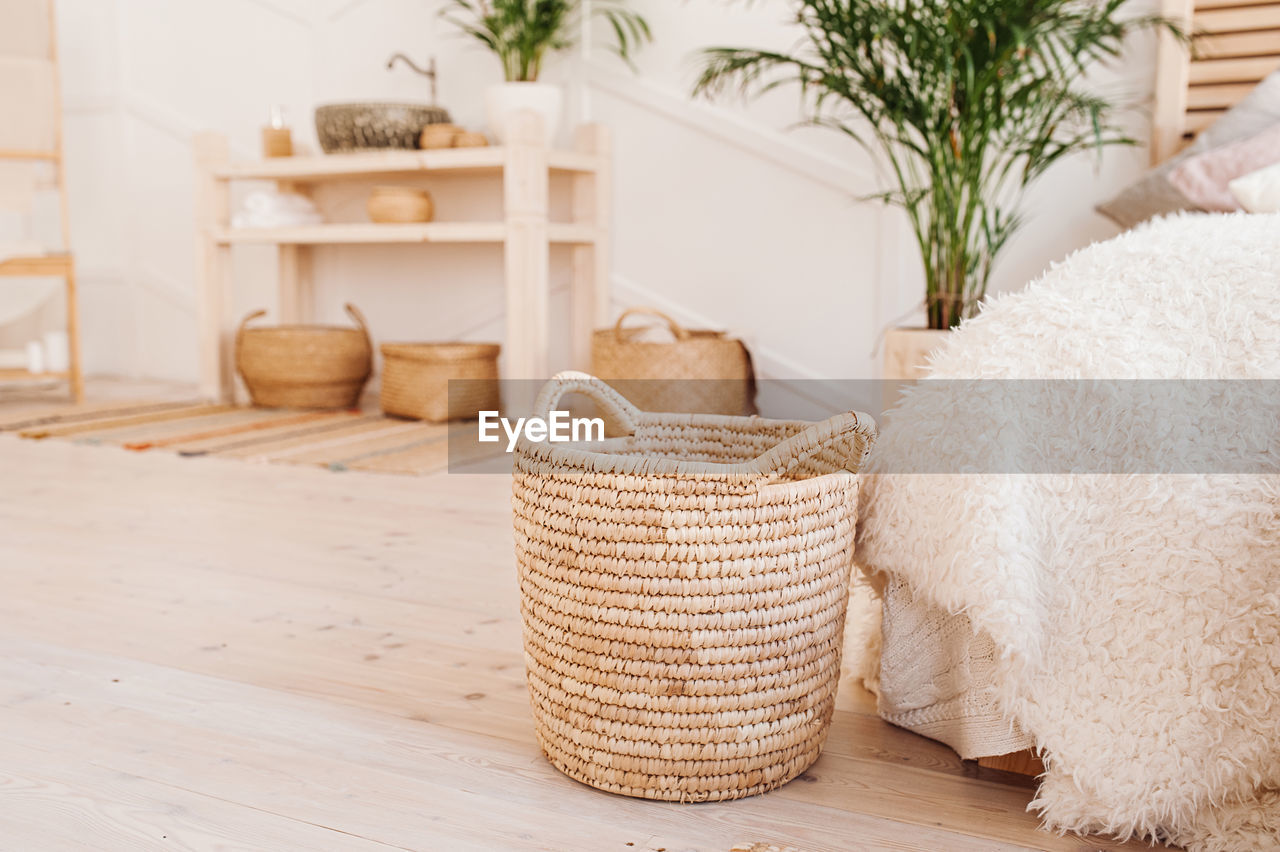 Light interior made of natural eco components. wicker straw basket for clothes