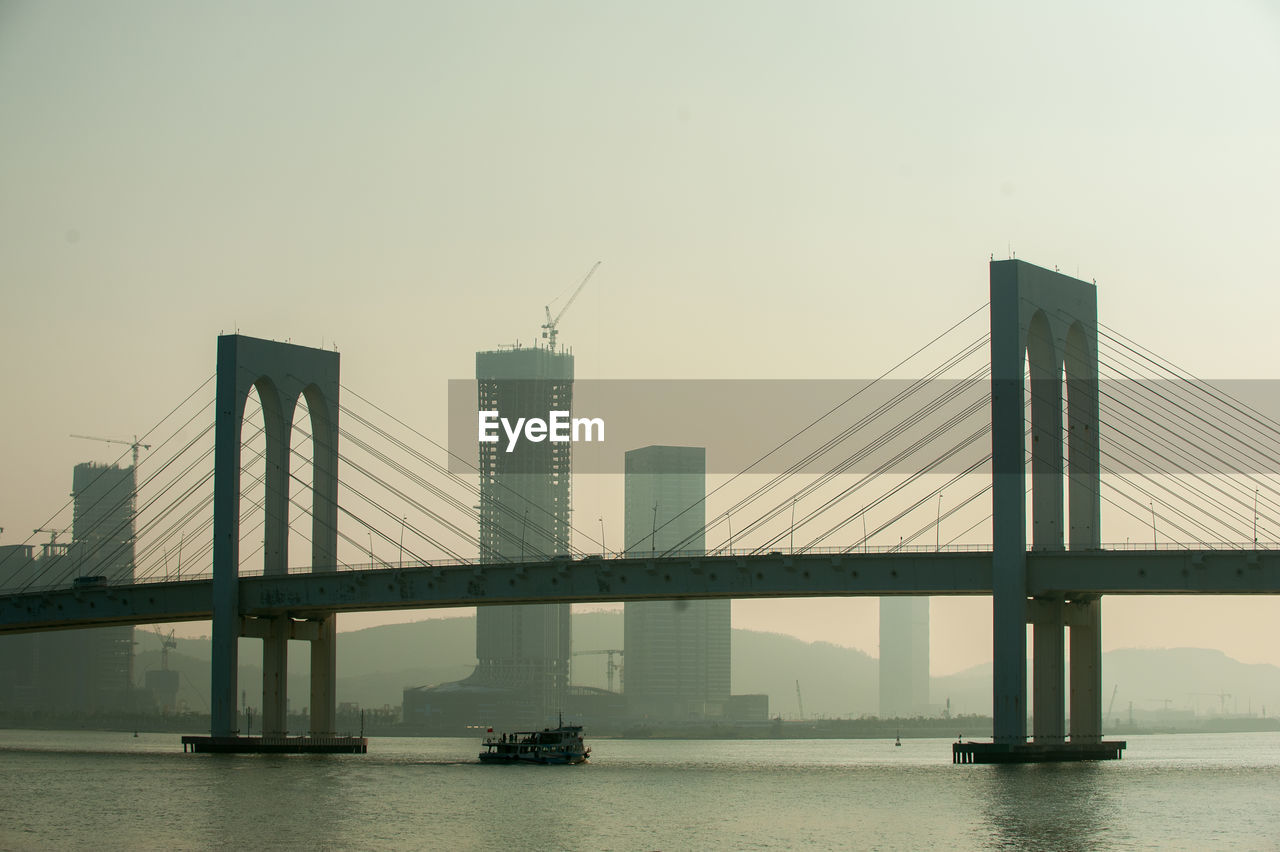 View of suspension bridge in city