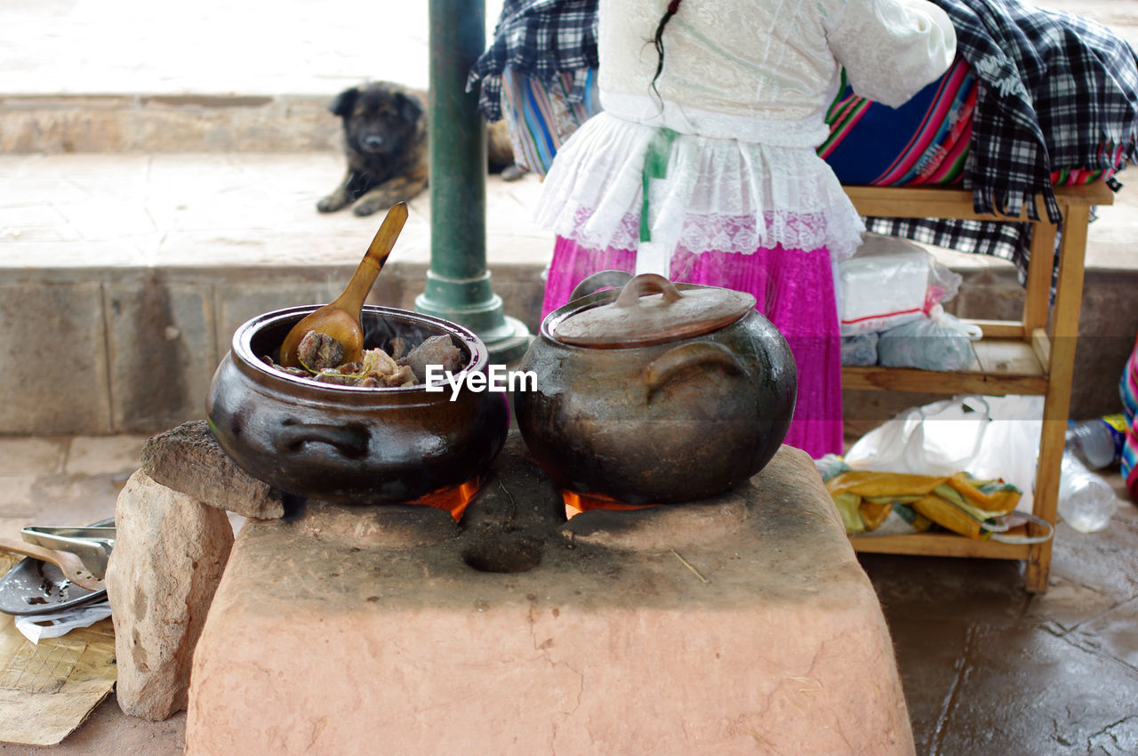 Midsection of woman preparing food on table