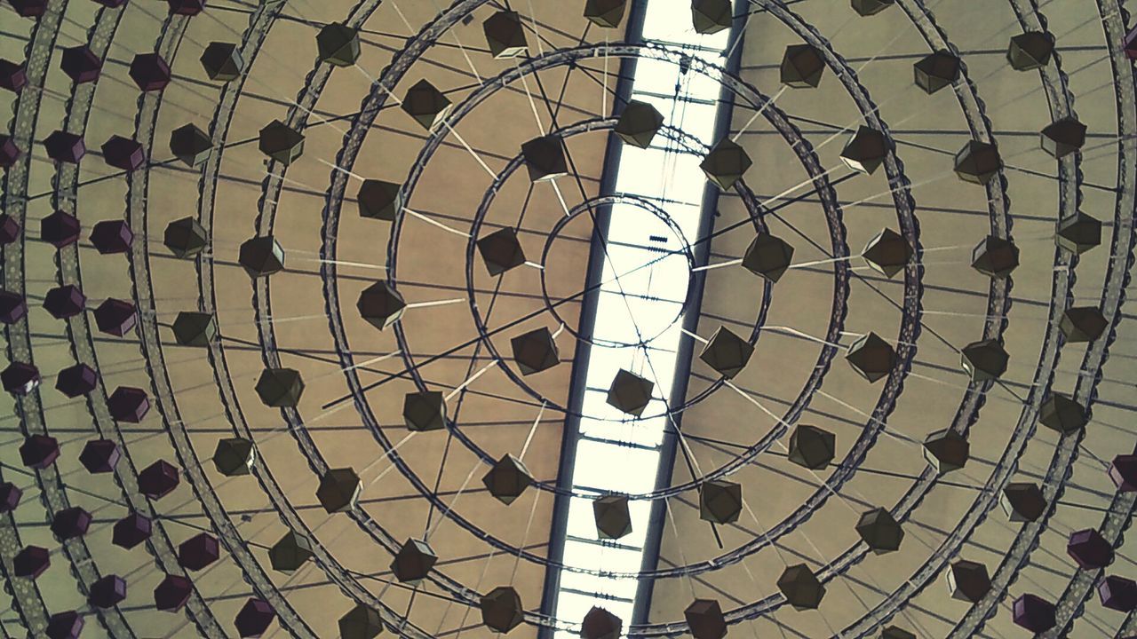 LOW ANGLE VIEW OF SKY SEEN THROUGH PATTERNED GLASS