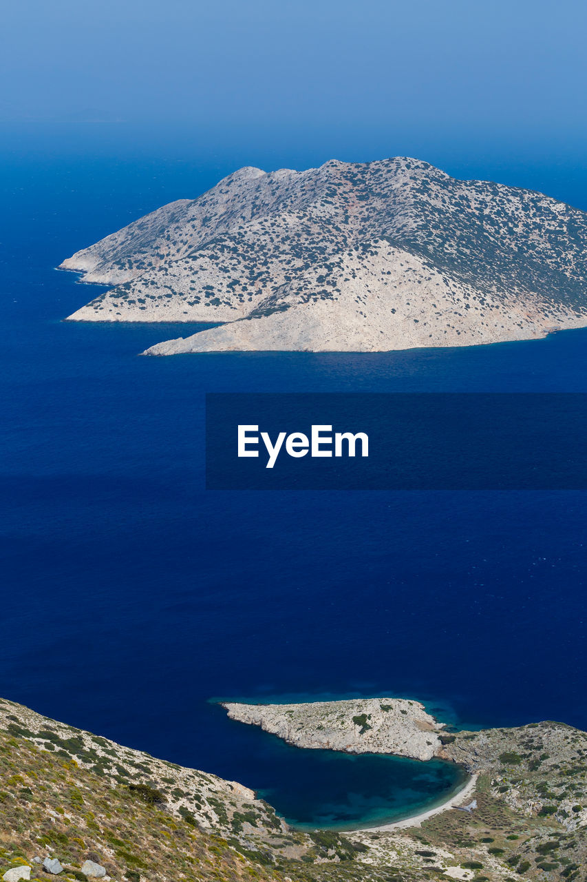 View of fourni coastline and agios minas island in the distance.