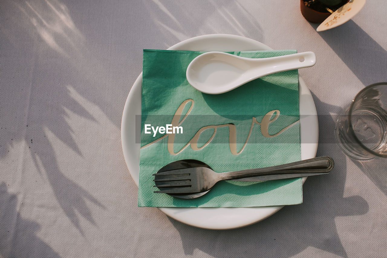 HIGH ANGLE VIEW OF EYEGLASSES ON TABLE WITH TEXT