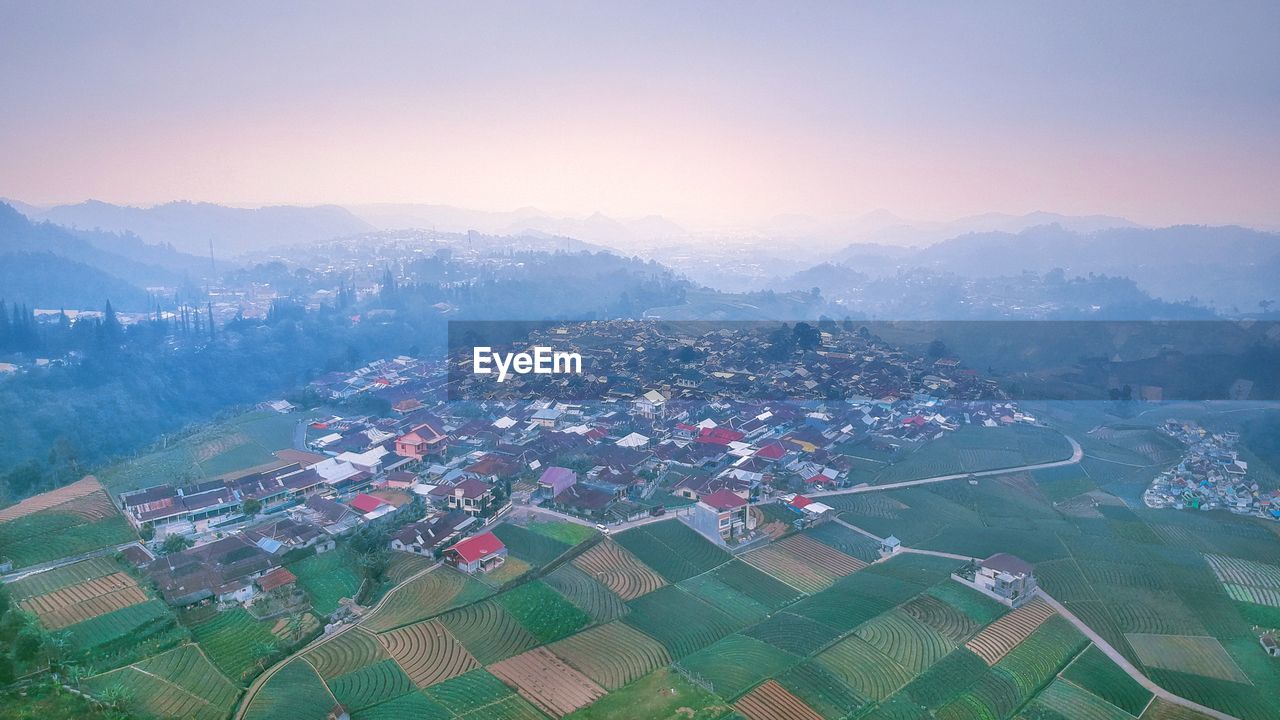 High angle view of buildings in city against sky