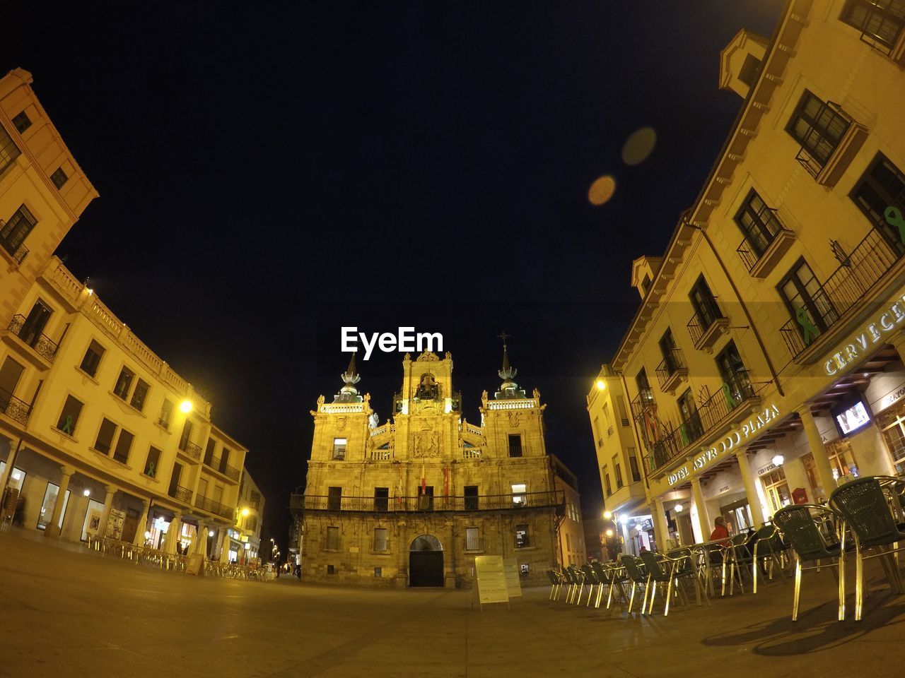 LOW ANGLE VIEW OF ILLUMINATED BUILDINGS AGAINST SKY