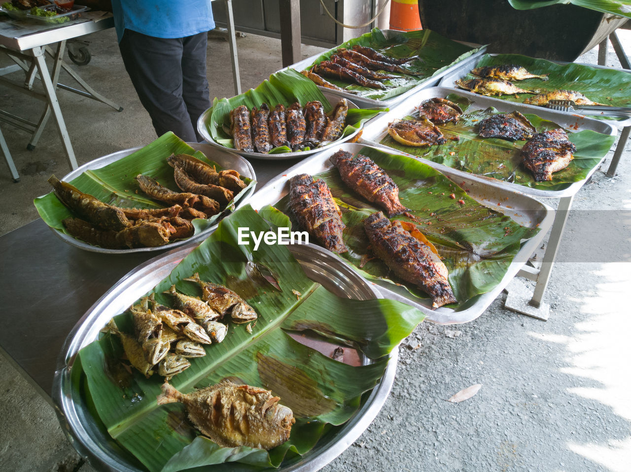 High angle view of malaysian tradisional fish menu on table.