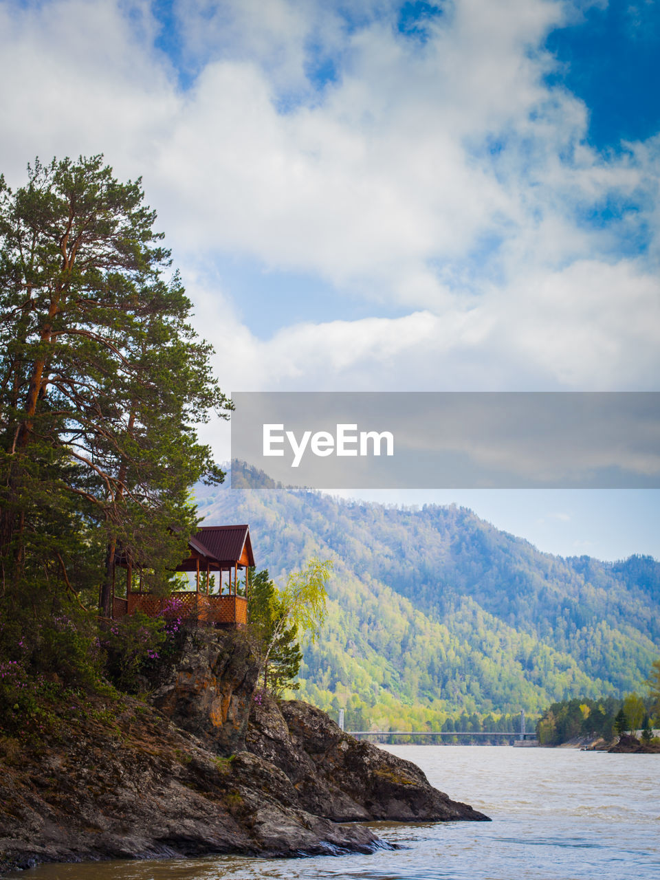 Beautiful mountains of the altai and a mountain river on a summer day with a clear blue sky