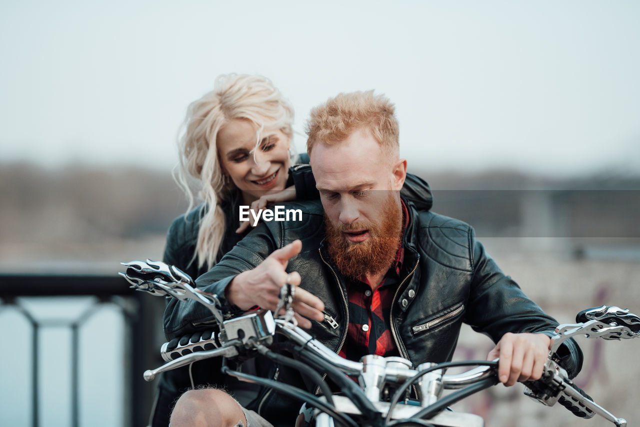 Portrait of friends riding bicycle