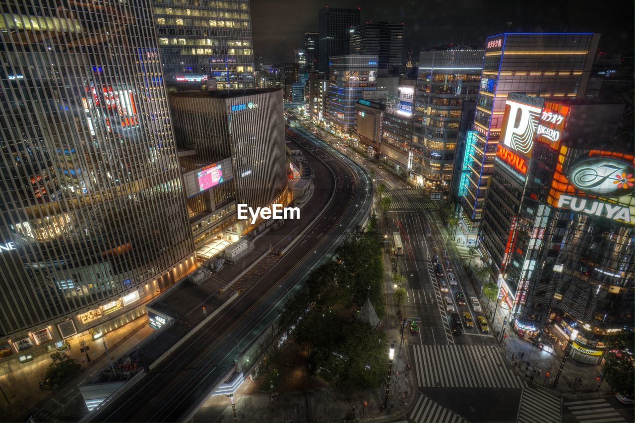 HIGH ANGLE VIEW OF LIGHT TRAILS ON CITY STREET AT NIGHT