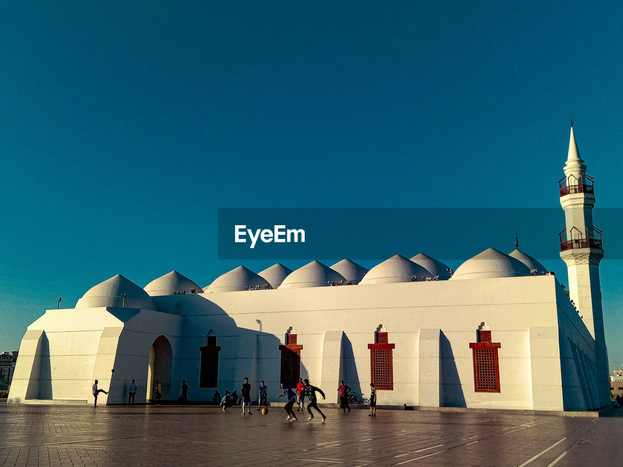 Teenager spent the day before sunset playing football at qishos mosque in jeddah, arab saudi