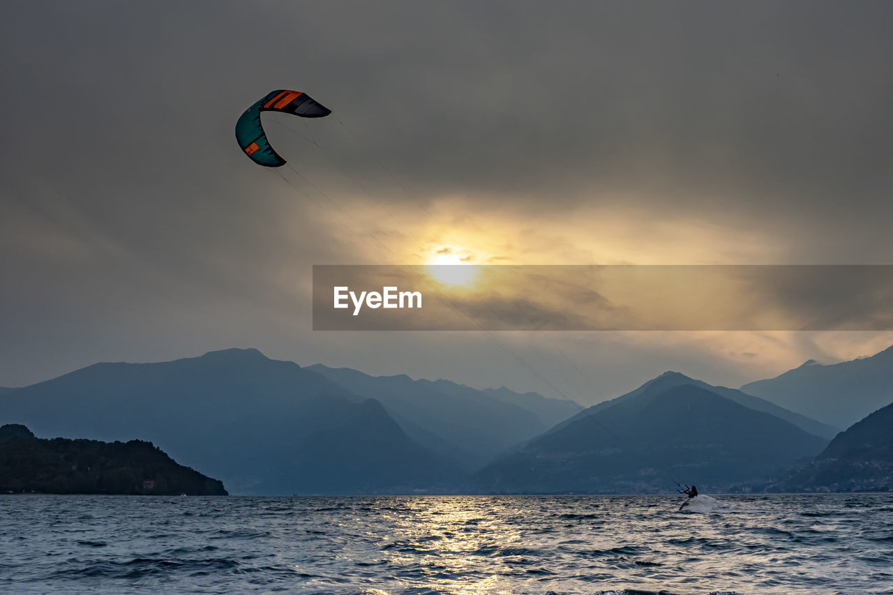 Kitesurfing scene at sunset on lake como