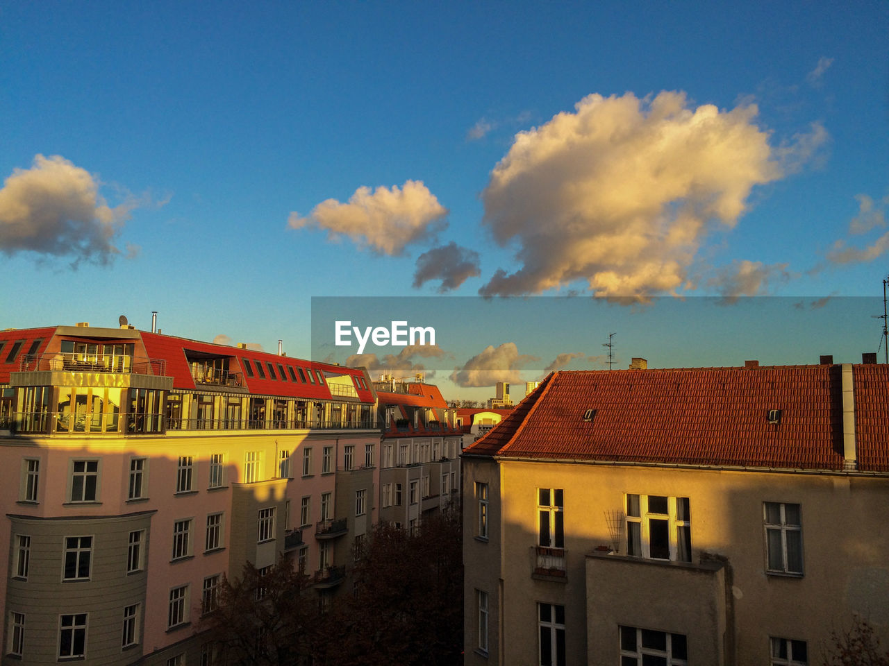 Residential buildings against blue sky