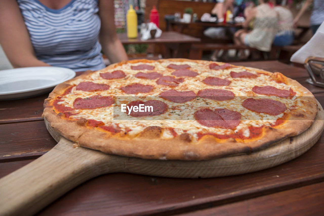 Close-up of pizza on table in restaurant