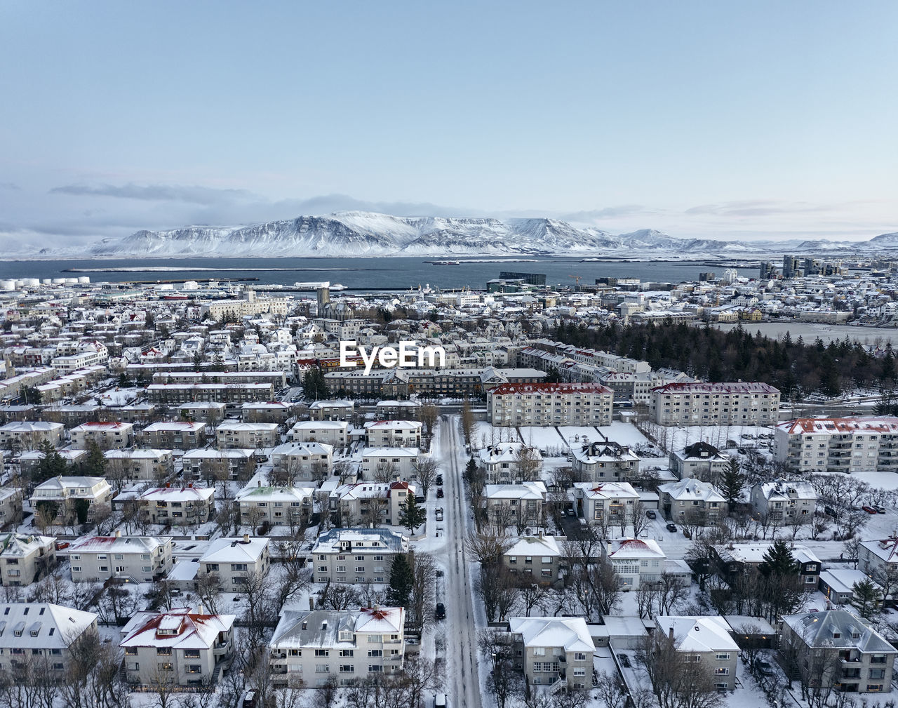 Buildings of snowy city from drone