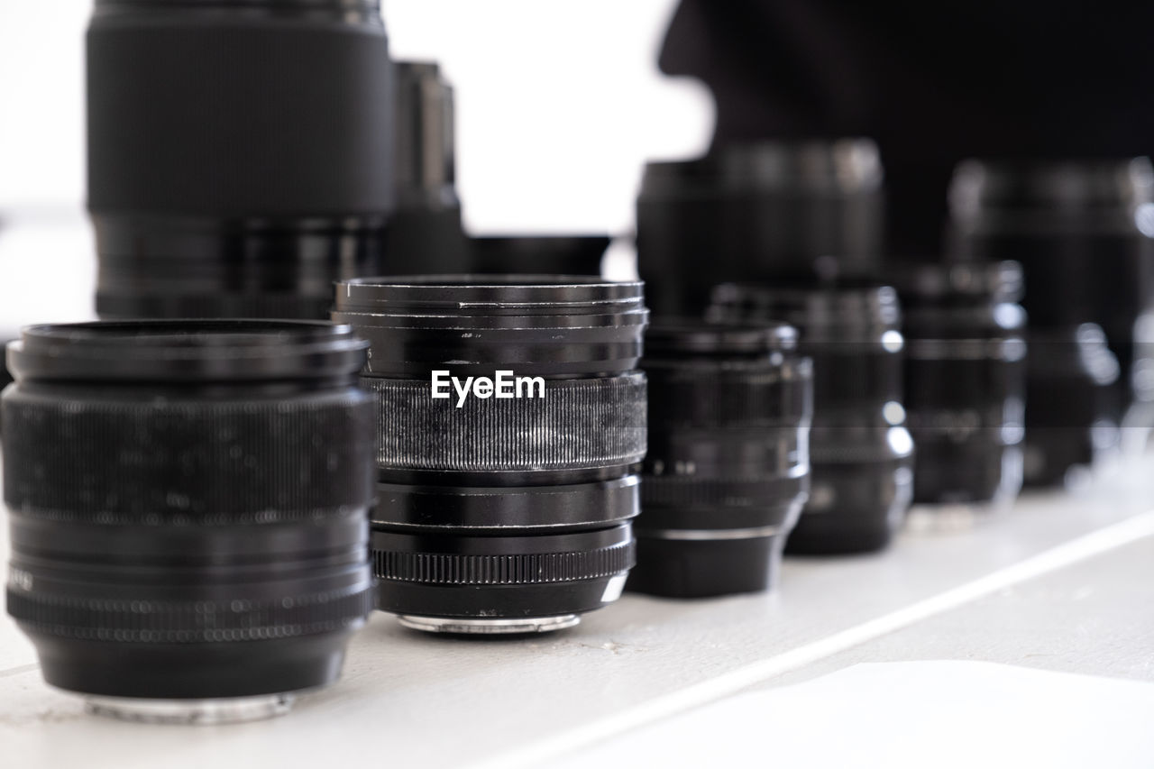 Close-up of lenses line on table