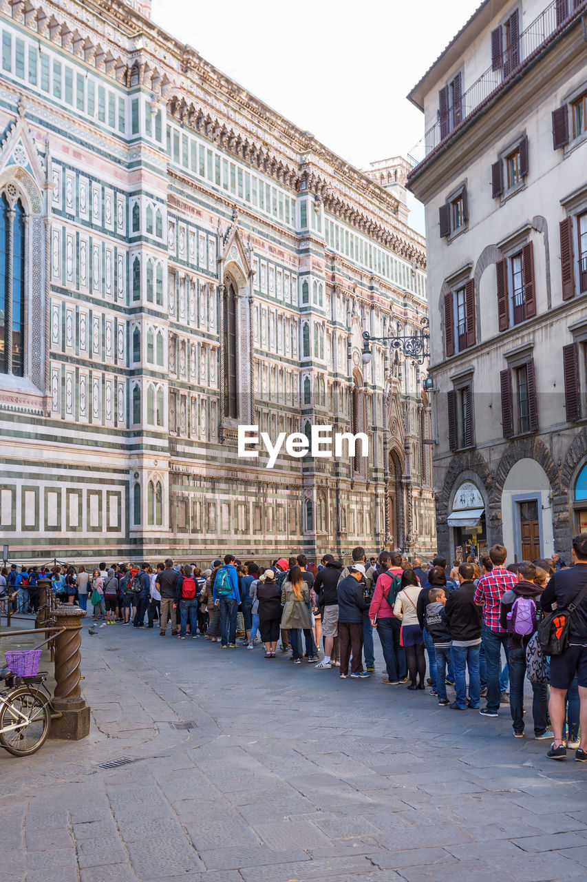 Tourists waiting in queue at cattedrale di santa maria del fiore in florence