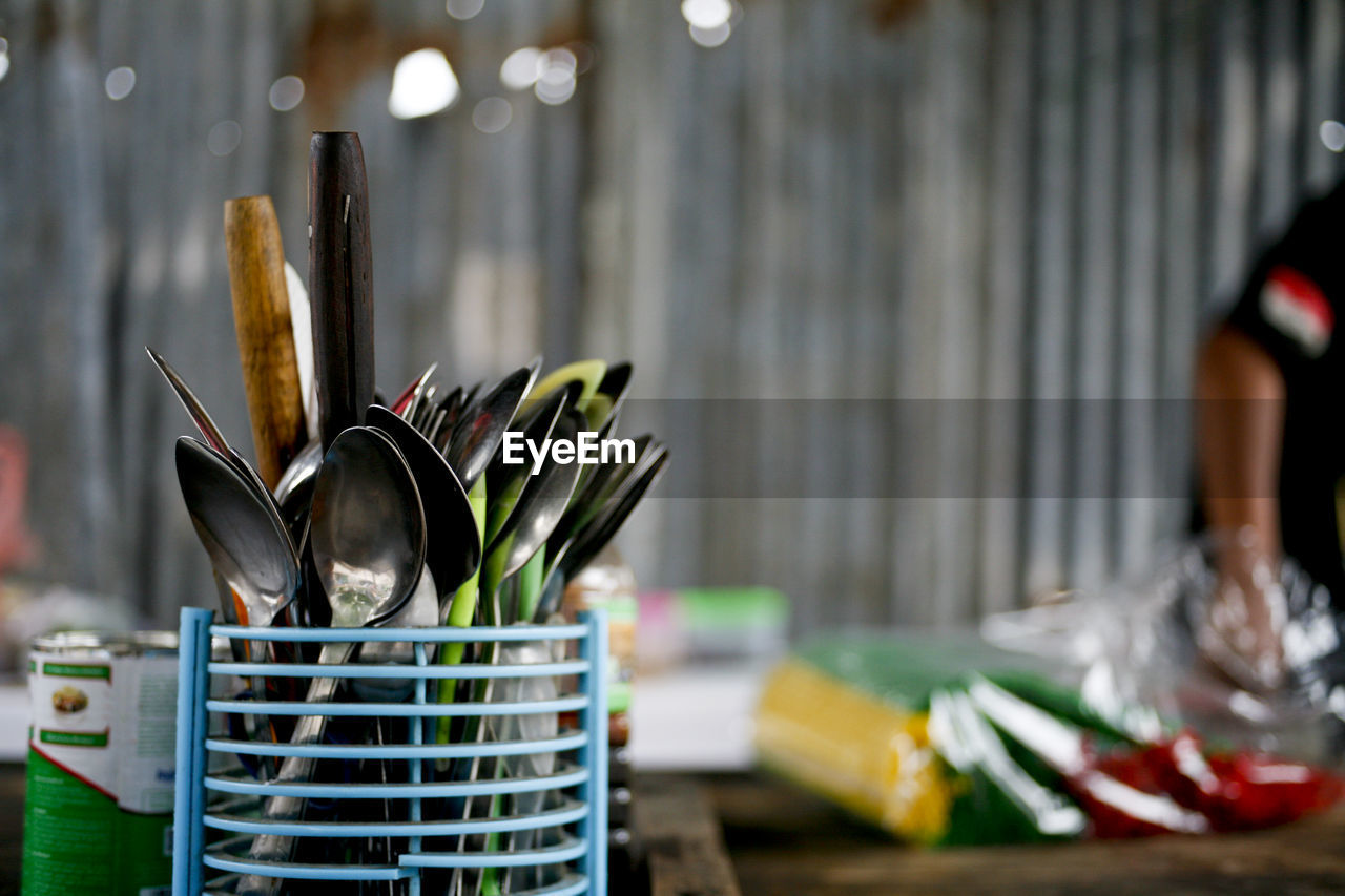 Close-up of kitchen utensils on table