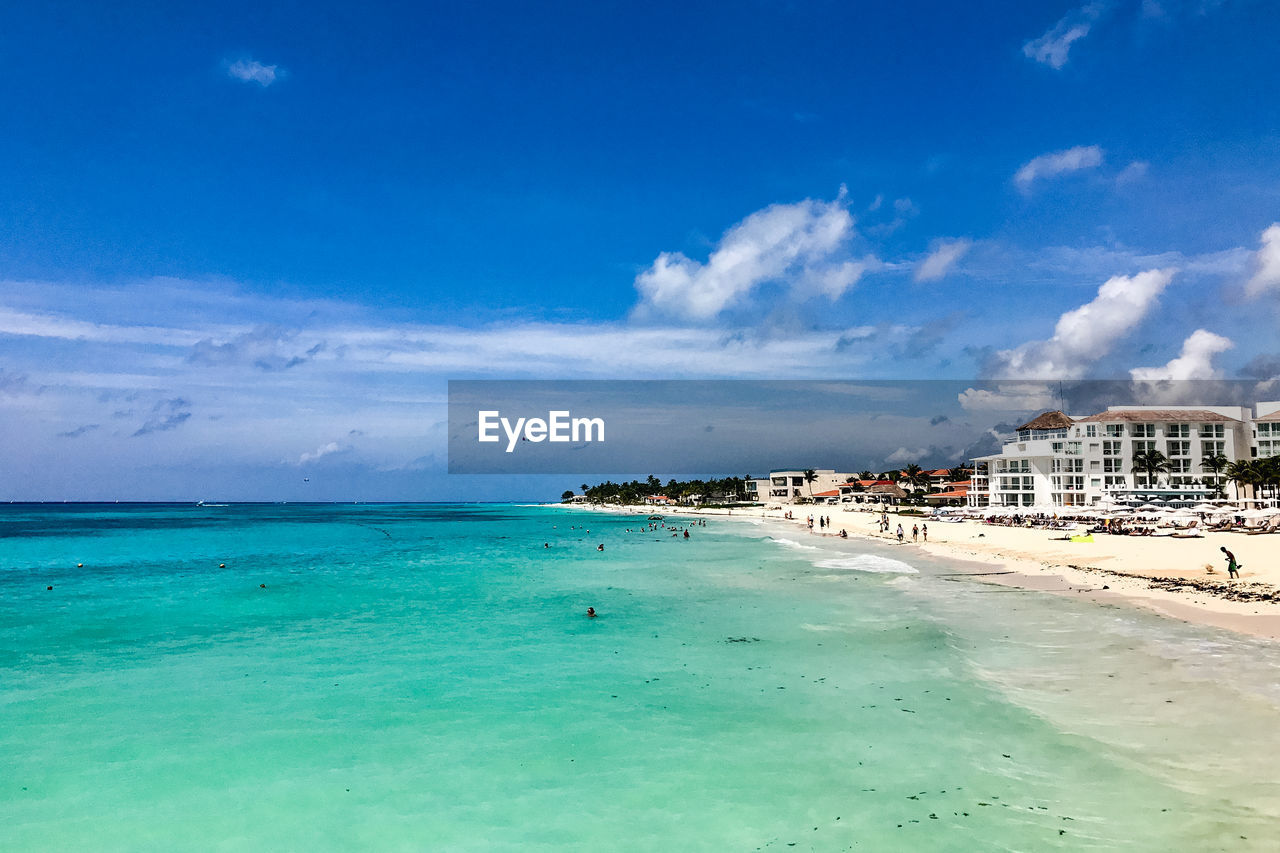 View of beach against cloudy sky