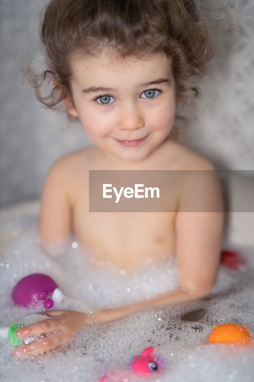 Portrait of cute girl in bathroom