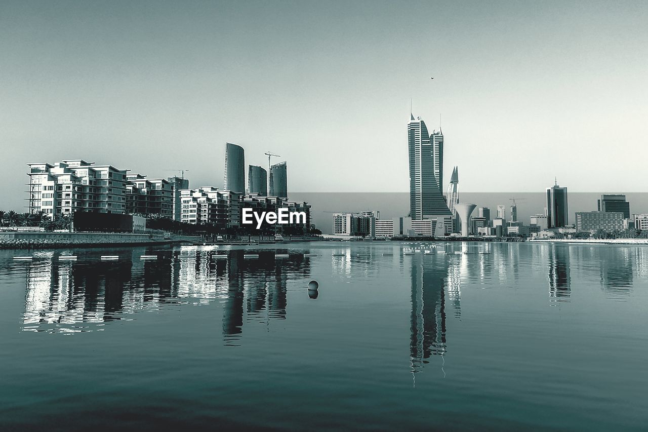 Modern buildings in city against clear sky