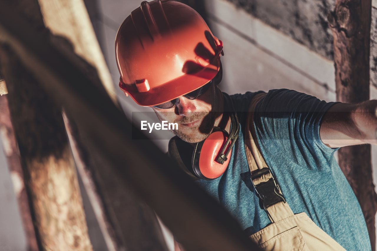 Close-up of worker working at industry