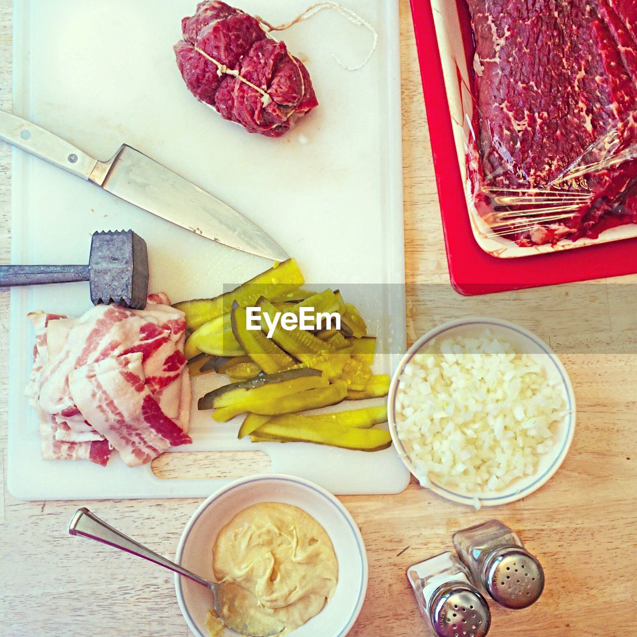 High angle view of raw steaks on table