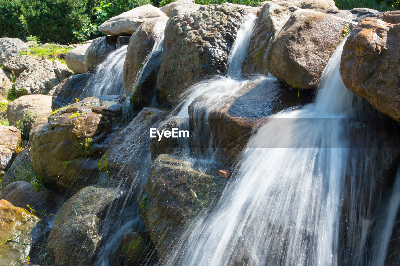 WATER FLOWING THROUGH ROCKS