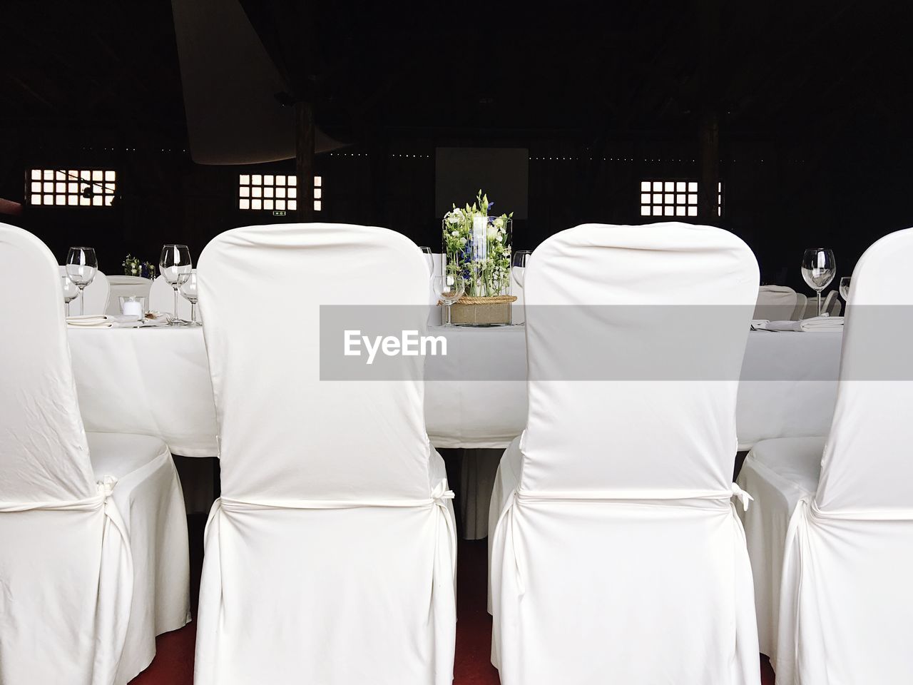 Chairs and table arranged at wedding reception