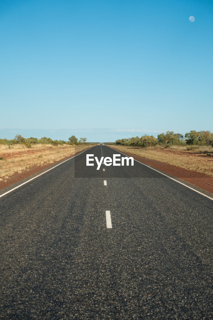 Empty road against clear sky