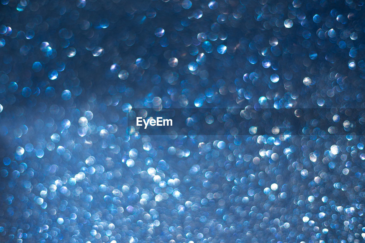 Defocused image of illuminated lights at night