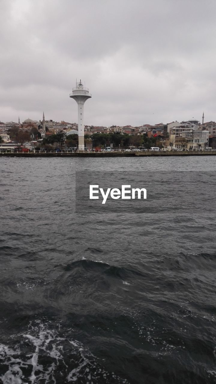 VIEW OF RIVER AGAINST CLOUDY SKY