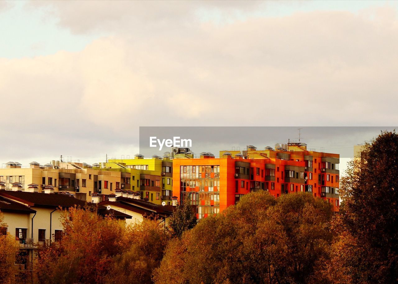 High angle view of buildings in town against sky