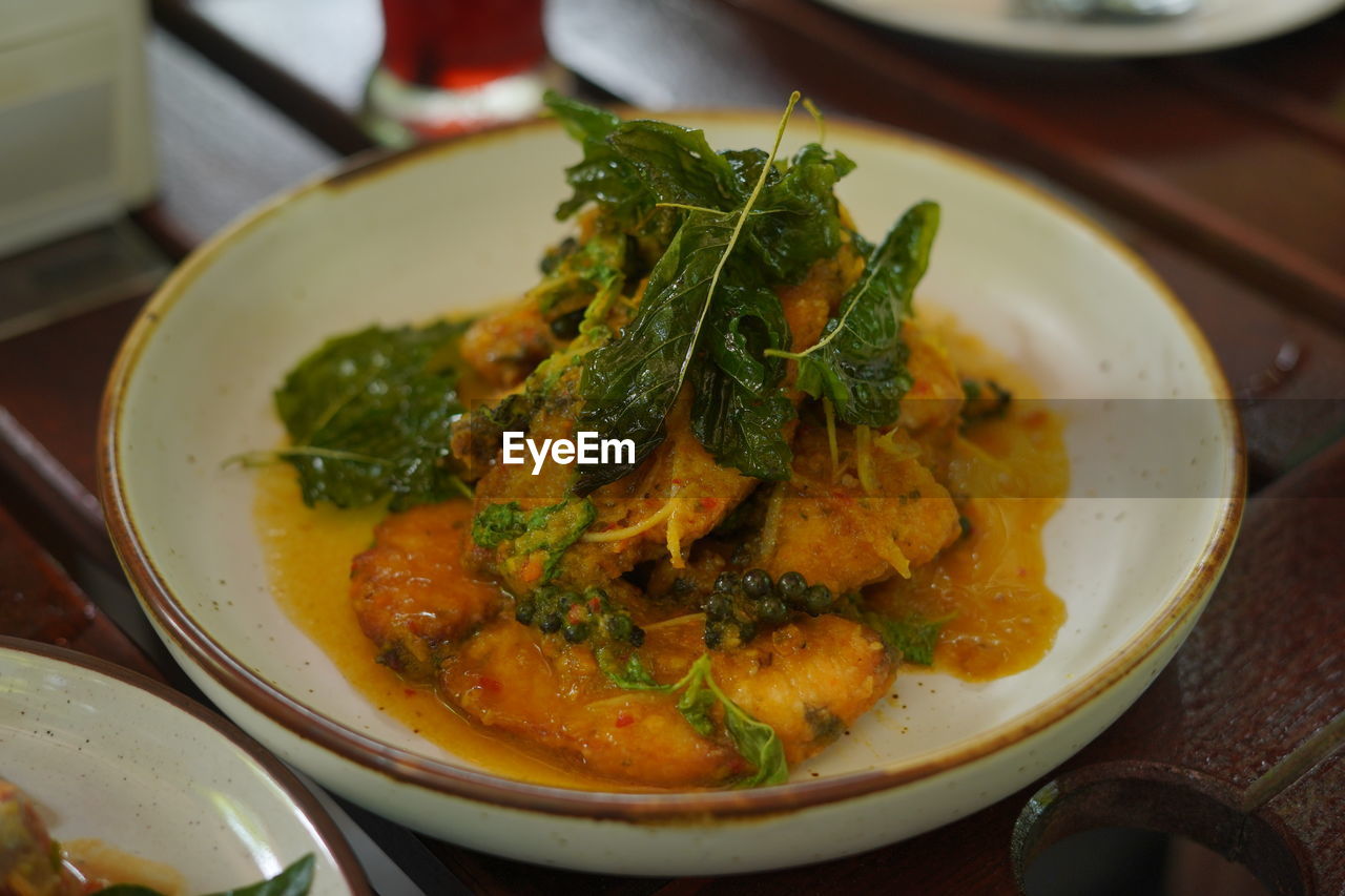 High angle view of fish in bowl on table